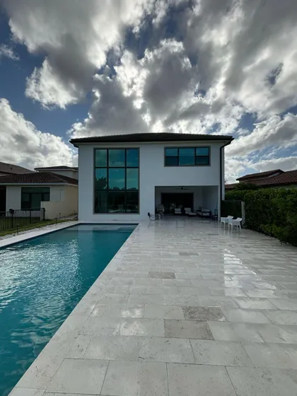 A modern home's pool deck gleaming after cleaning
